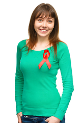 Image showing Woman with the red awareness ribbon