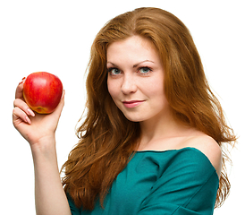 Image showing Young happy girl with apple