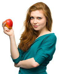 Image showing Young happy girl with apple