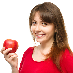 Image showing Young happy girl with apple