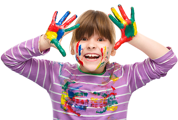 Image showing Portrait of a cute girl playing with paints