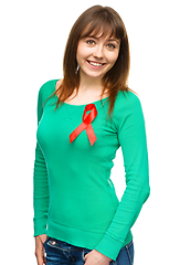 Image showing Woman with the red awareness ribbon