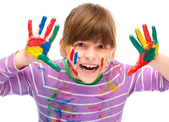 Image showing Portrait of a cute girl playing with paints