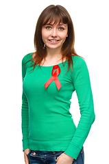 Image showing Woman with the red awareness ribbon