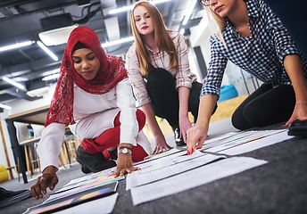 Image showing black muslim woman having meeting with Multiethnic  startup busi