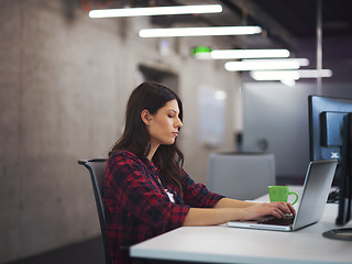 Image showing female software developer using laptop computer