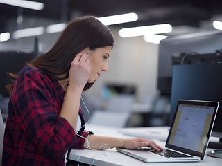 Image showing female software developer using laptop computer