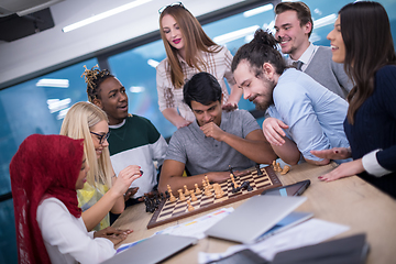 Image showing multiethnic group of business people playing chess