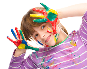 Image showing Portrait of a cute girl playing with paints