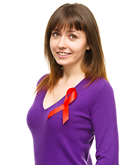 Image showing Woman with the red awareness ribbon
