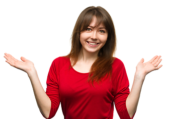 Image showing Portrait of a young woman raised her hands up