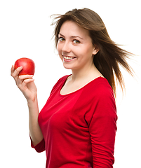 Image showing Young happy girl with apple