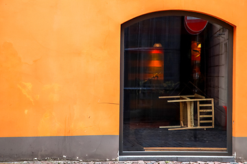 Image showing Orange wall with window in Riga.