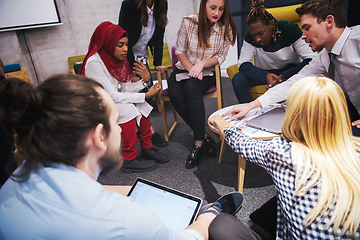 Image showing Multiethnic startup business team having meeting