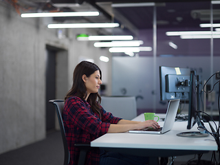 Image showing female software developer using laptop computer