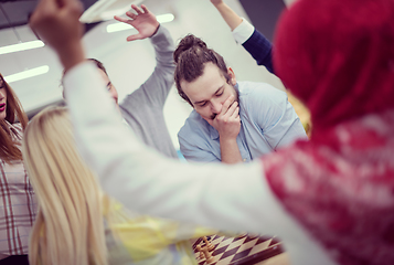 Image showing multiethnic group of business people playing chess