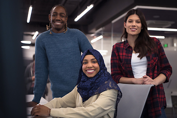 Image showing multiethnics team of software developers working together