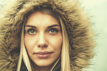 Image showing portrait of young blonde girl wearing winter jacket