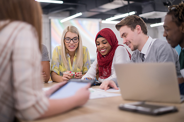 Image showing Multiethnic startup business team having meeting