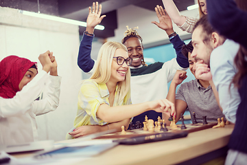 Image showing multiethnic group of business people playing chess