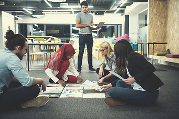 Image showing black muslim woman having meeting with Multiethnic  startup busi