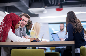 Image showing Multiethnic startup business team having meeting