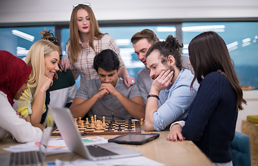 Image showing multiethnic group of business people playing chess