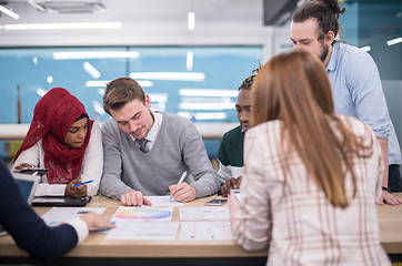 Image showing Multiethnic startup business team having meeting