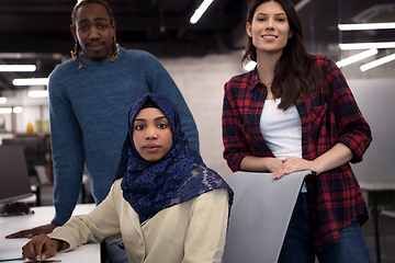 Image showing multiethnics team of software developers working together