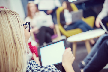 Image showing blonde businesswoman using digital tablet