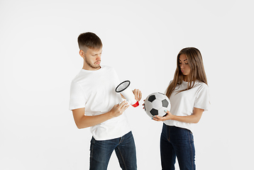 Image showing Portrait of beautiful couple football fans on white studio background