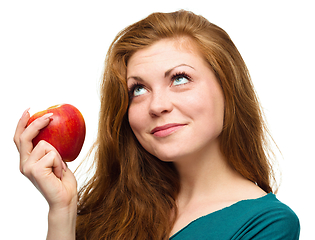 Image showing Young happy girl with apple