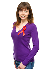 Image showing Woman with the red awareness ribbon