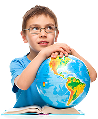 Image showing Little boy is holding globe