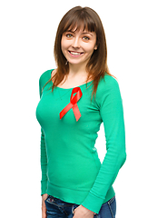 Image showing Woman with the red awareness ribbon