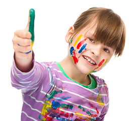 Image showing Portrait of a cute girl playing with paints