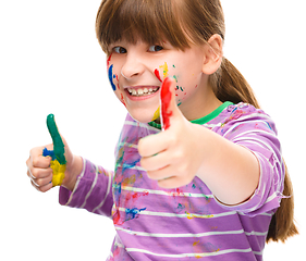 Image showing Portrait of a cute girl playing with paints