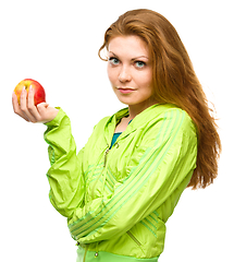 Image showing Young happy girl with apple