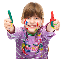 Image showing Portrait of a cute girl playing with paints