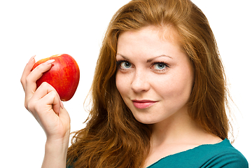 Image showing Young happy girl with apple