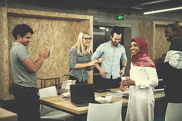 Image showing multiethnic Group of young business people celebrating success