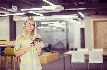 Image showing blonde businesswoman working online using digital tablet