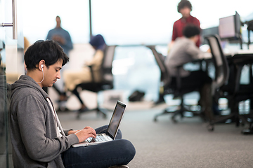 Image showing software developer working on the floor