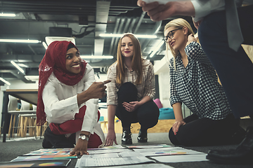 Image showing black muslim woman having meeting with Multiethnic  startup busi