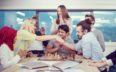 Image showing multiethnic group of business people playing chess