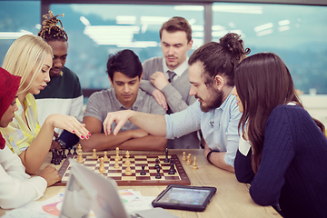 Image showing multiethnic group of business people playing chess