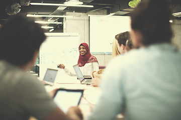 Image showing Muslim businesswoman giving presentations at office