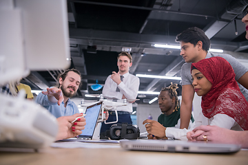 Image showing multiethnic business team learning about drone technology