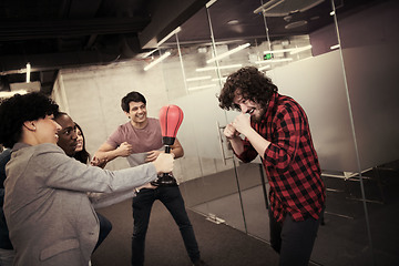 Image showing multiethnics business team boxing at office