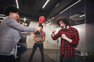 Image showing multiethnics business team boxing at office